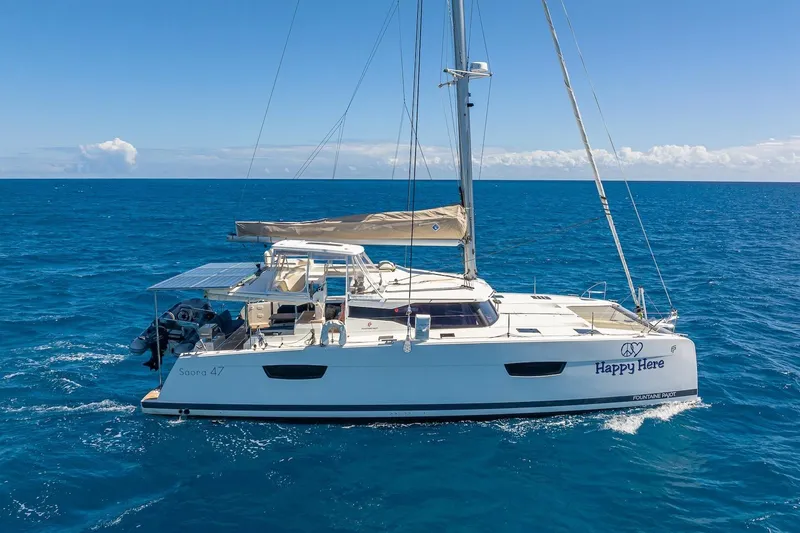 Slide: The Image of 2020 Fountaine Pajot Saona 47 catamaran sailing on open blue sea. - 19