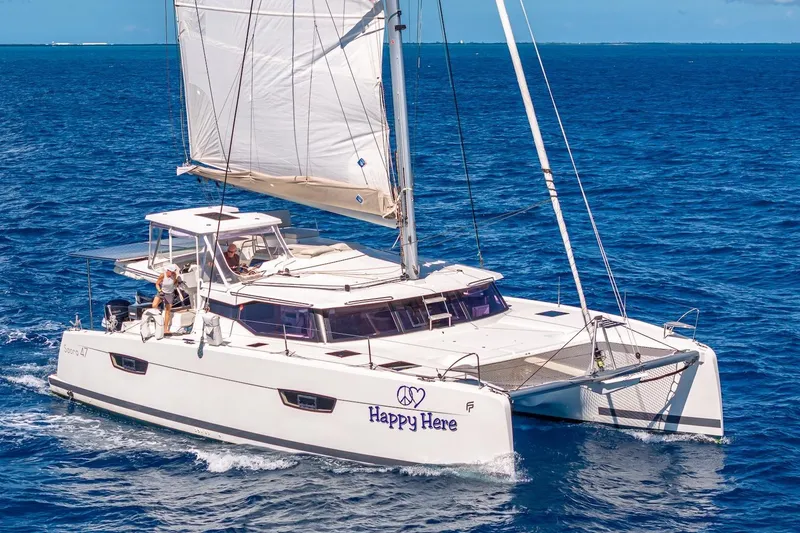 Slide: The Image of 2020 Fountaine Pajot Saona 47 catamaran sailing on open blue sea. - 20