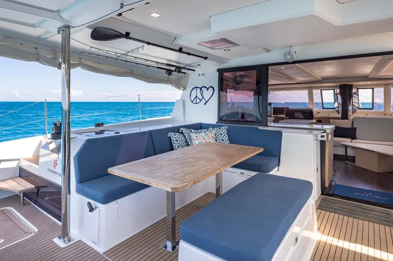 Slide: The Image of Luxurious 2020 Fountaine Pajot Saona 47 yacht interior with ocean view and comfortable seating. - 21