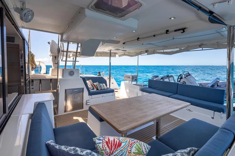 Slide: The Image of Luxurious 2020 Fountaine Pajot Saona 47 yacht interior with ocean view and elegant seating. - 23