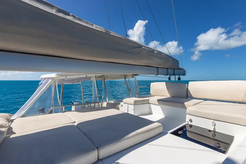 Slide: The Image of 2020 Fountaine Pajot Saona 47 catamaran with spacious deck, sailing on clear blue ocean. - 27