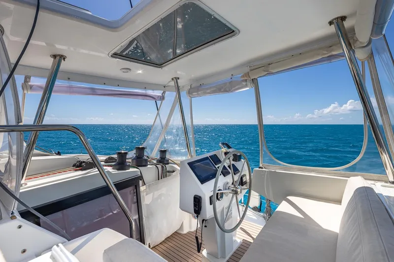 Slide: The Image of Cockpit of 2020 Fountaine Pajot Saona 47 catamaran with ocean view. - 31