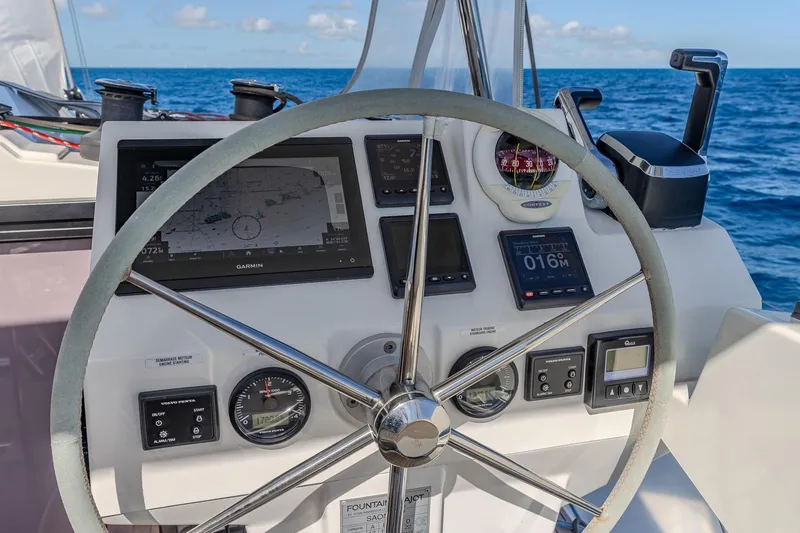 Slide: The Image of Steering wheel and navigation instruments on 2020 Fountaine Pajot Saona 47 catamaran. - 32