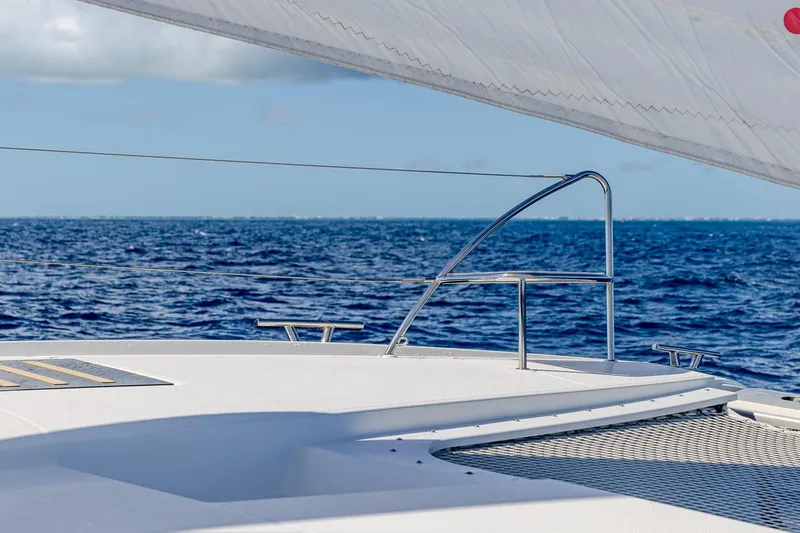 Slide: The Image of Fountaine Pajot Saona 47 sailing on open sea, 2020 model, with clear blue skies. - 34