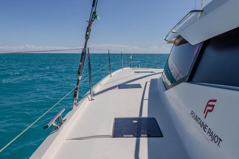 Slide: The Image of 2020 Fountaine Pajot Saona 47 catamaran sailing on clear blue ocean waters. - 39