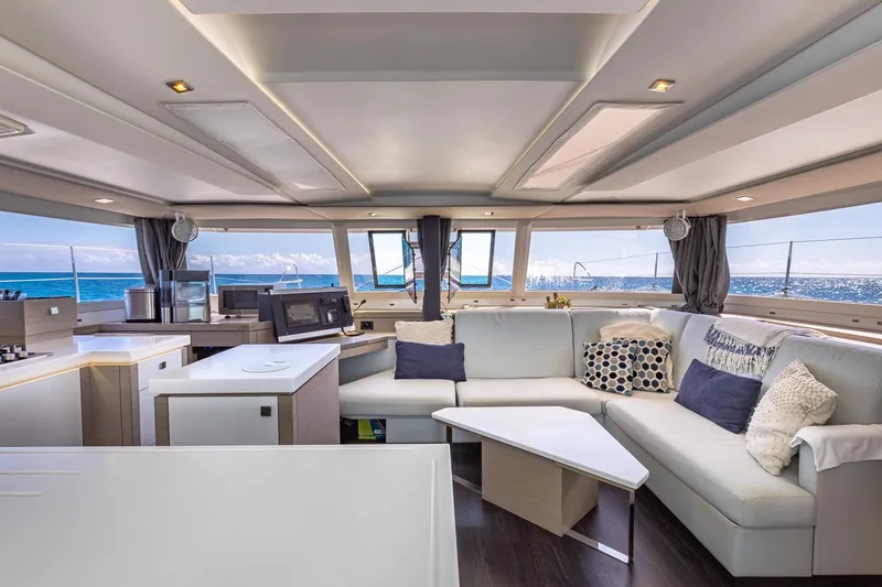 Slide: The Image of Luxurious interior of 2020 Fountaine Pajot Saona 47 catamaran with modern furnishings and ocean view. - 4
