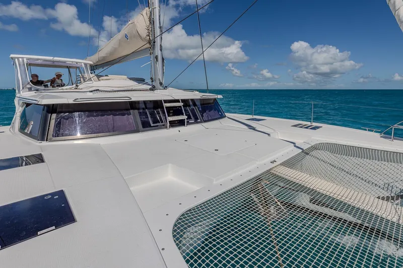 Slide: The Image of 2020 Fountaine Pajot Saona 47 catamaran sailing on clear blue ocean. - 41