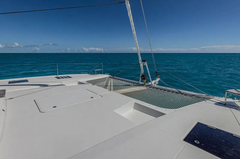 Slide: The Image of 2020 Fountaine Pajot Saona 47 catamaran on open sea, clear blue sky, and ocean view. - 43