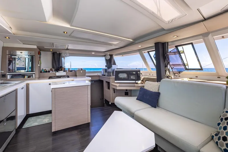 Slide: The Image of Luxurious interior of 2020 Fountaine Pajot Saona 47 catamaran with modern kitchen and seating area. - 46