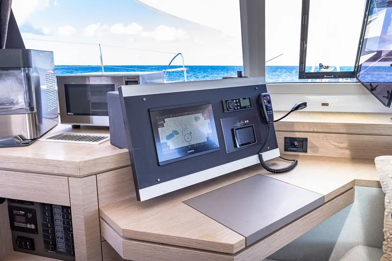 Slide: The Image of Navigation station on 2020 Fountaine Pajot Saona 47 catamaran with ocean view. - 49