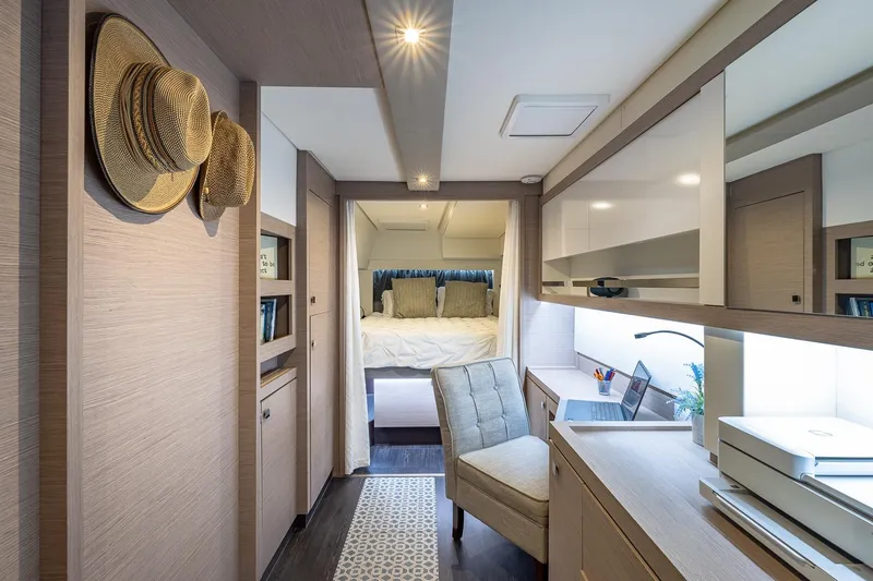 Slide: The Image of Luxurious interior of 2020 Fountaine Pajot Saona 47 yacht with cozy bedroom and workspace. - 5