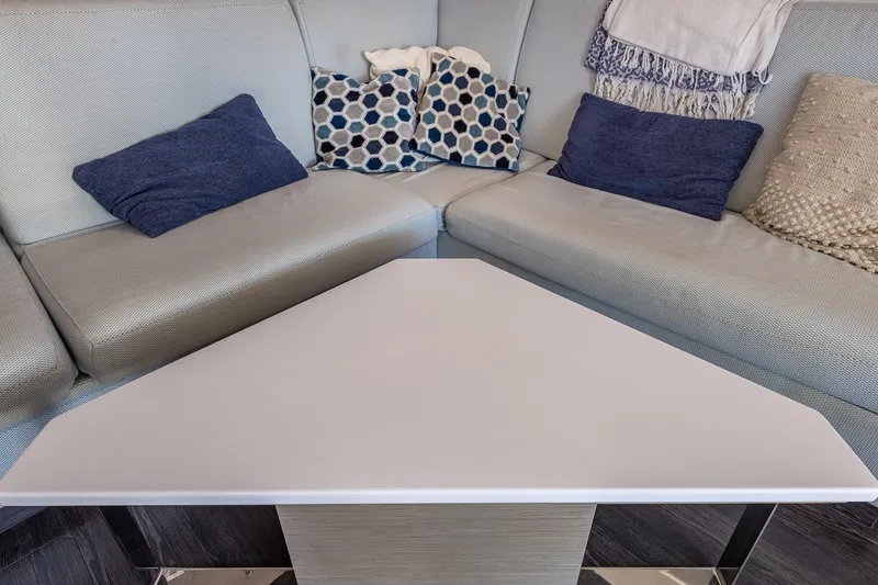 Slide: The Image of Interior of 2020 Fountaine Pajot Saona 47 with cozy seating and decorative pillows. - 50