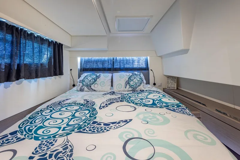 Slide: The Image of Luxurious cabin interior of 2020 Fountaine Pajot Saona 47 with turtle-themed bedding. - 65