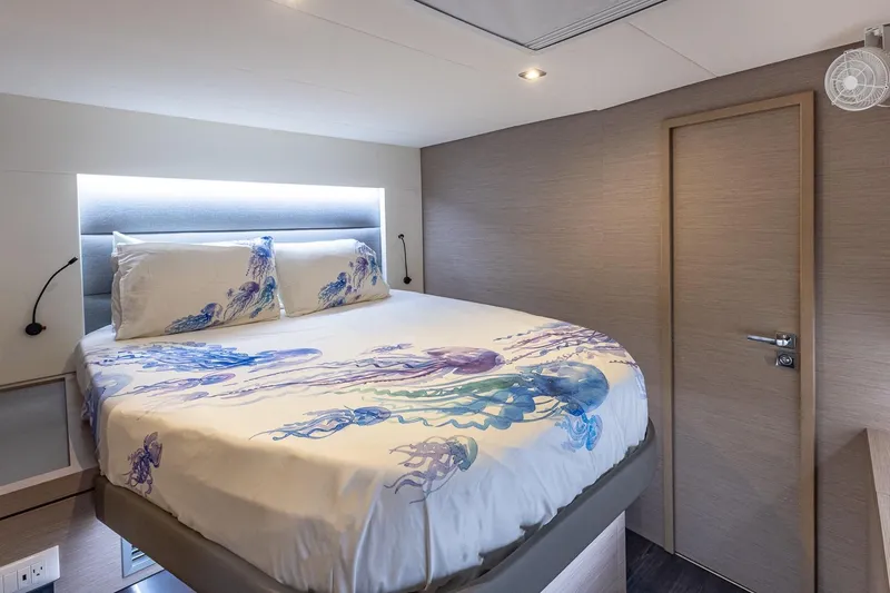 Slide: The Image of Luxurious bedroom interior on 2020 Fountaine Pajot Saona 47 yacht with jellyfish-themed bedding. - 69