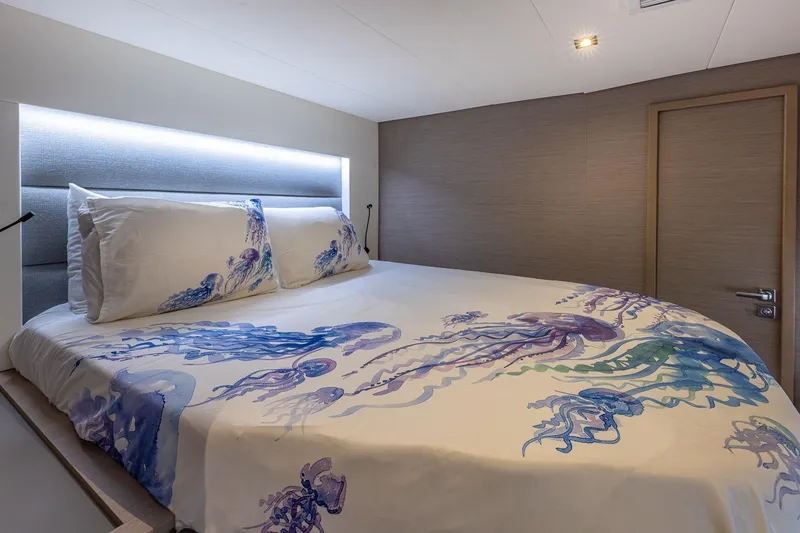 Slide: The Image of Luxurious bedroom in 2020 Fountaine Pajot Saona 47 yacht with jellyfish-themed bedding. - 71