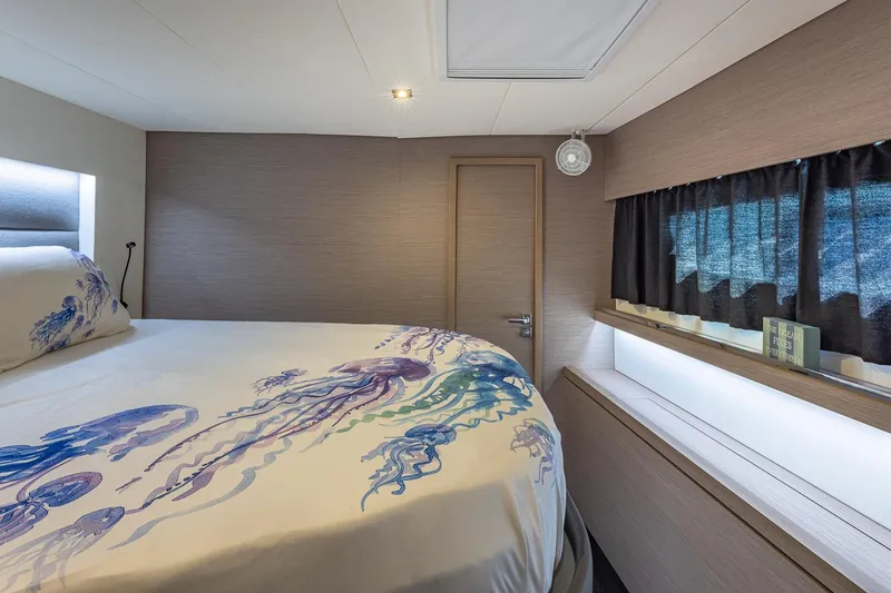 Slide: The Image of Luxurious bedroom interior of 2020 Fountaine Pajot Saona 47 yacht with ocean-themed bedding. - 72