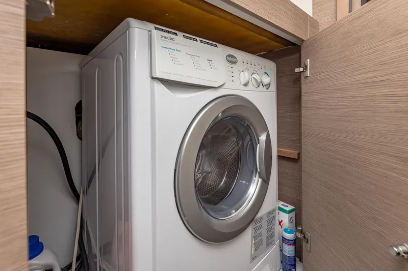 Slide: The Image of Washing machine in a 2020 Fountaine Pajot Saona 47 yacht's wooden cabinet. - 75