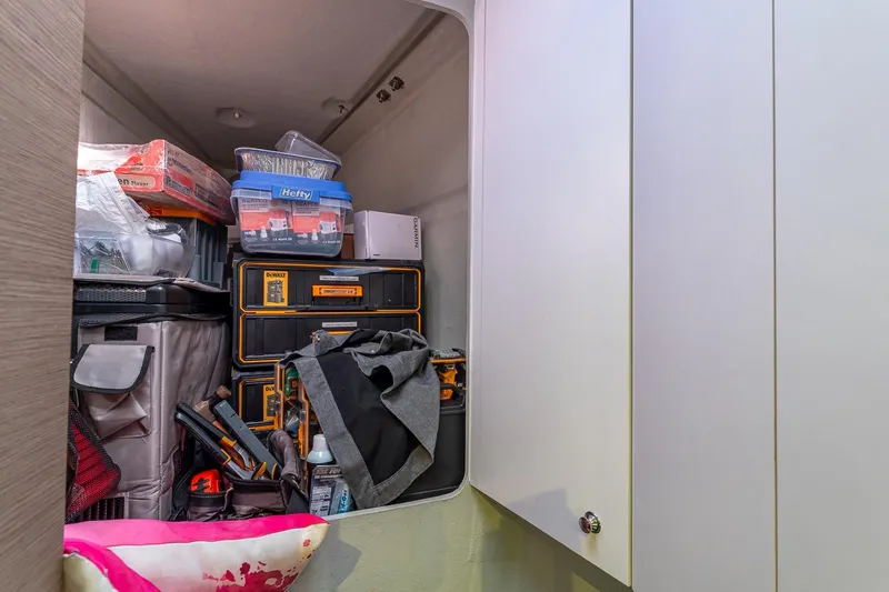 Slide: The Image of Storage area on 2020 Fountaine Pajot Saona 47 yacht, filled with tools and supplies. - 76