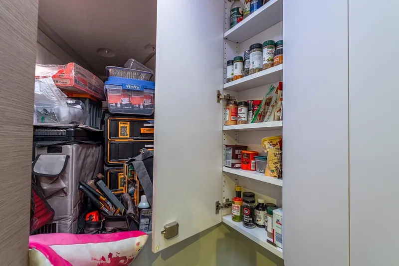 Slide: The Image of Storage cabinet with spices and tools on a 2020 Fountaine Pajot Saona 47 yacht. - 77