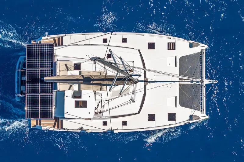 Slide: The Image of Aerial view of 2020 Fountaine Pajot Saona 47 catamaran sailing on blue ocean. - 8