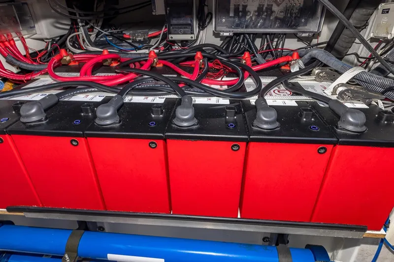 Slide: The Image of Battery compartment of a 2020 Fountaine Pajot Saona 47 catamaran with red and black wiring. - 84
