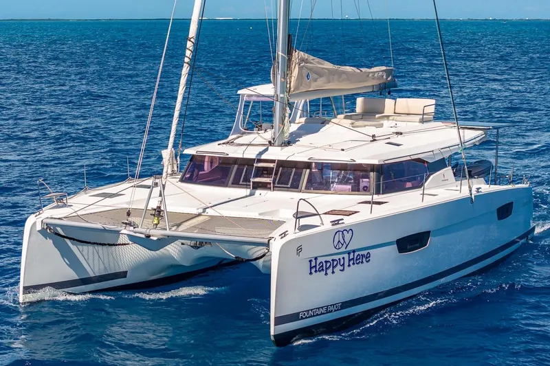 Slide: The Image of 2020 Fountaine Pajot Saona 47 catamaran sailing on blue ocean waters. - 9