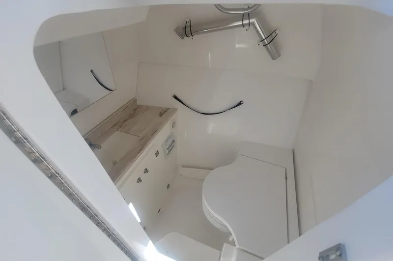 Slide: The Image of 2021 Pursuit DC 326 Dual Console boat interior with modern amenities. - 28