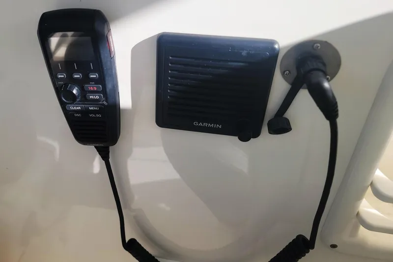 Slide: The Image of 2021 Pursuit DC 326 Dual Console boat with Garmin marine radio equipment. - 9