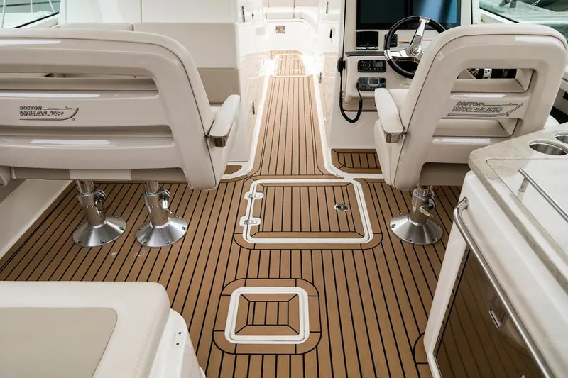 Slide: The Image of Manufacturer Provided Image: 2018 Boston Whaler 320 Vantage interior with teak flooring and dual captain chairs. - 27