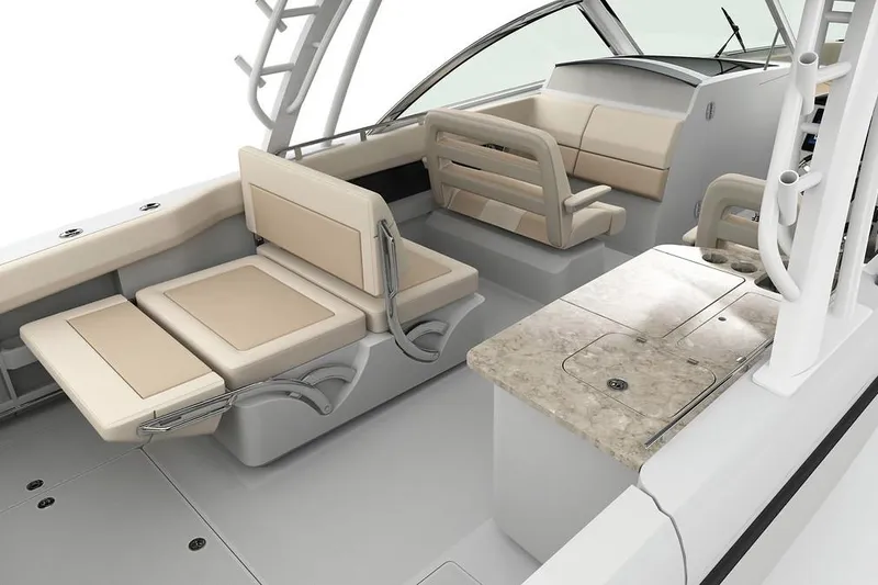Slide: The Image of Manufacturer Provided Image: 2018 Boston Whaler 320 Vantage interior with beige seating and a marble countertop. - 28