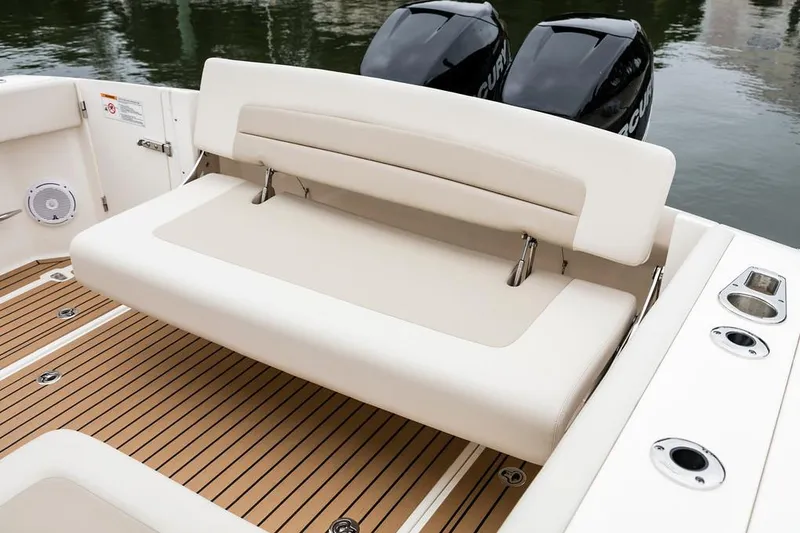 Slide: The Image of Manufacturer Provided Image: 2018 Boston Whaler 320 Vantage boat with foldable rear bench seat and twin outboard engines. - 29