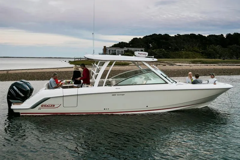 Slide: The Image of Manufacturer Provided Image: 2018 Boston Whaler 320 Vantage boat cruising with passengers on a calm waterway. - 31