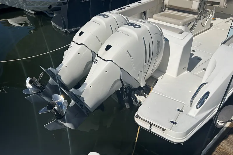 Slide: The Image of 2018 Boston Whaler 320 Vantage with twin Mercury outboard engines docked. - 5