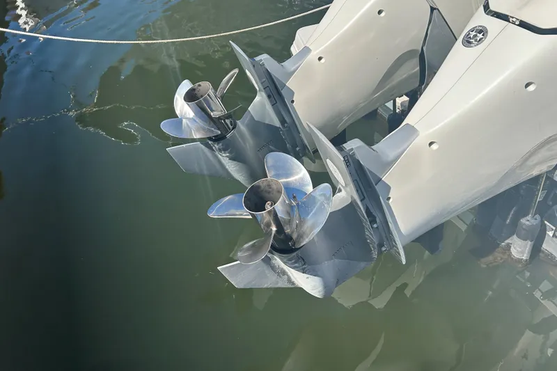 Slide: The Image of Twin propellers of a 2018 Boston Whaler 320 Vantage in water. - 7