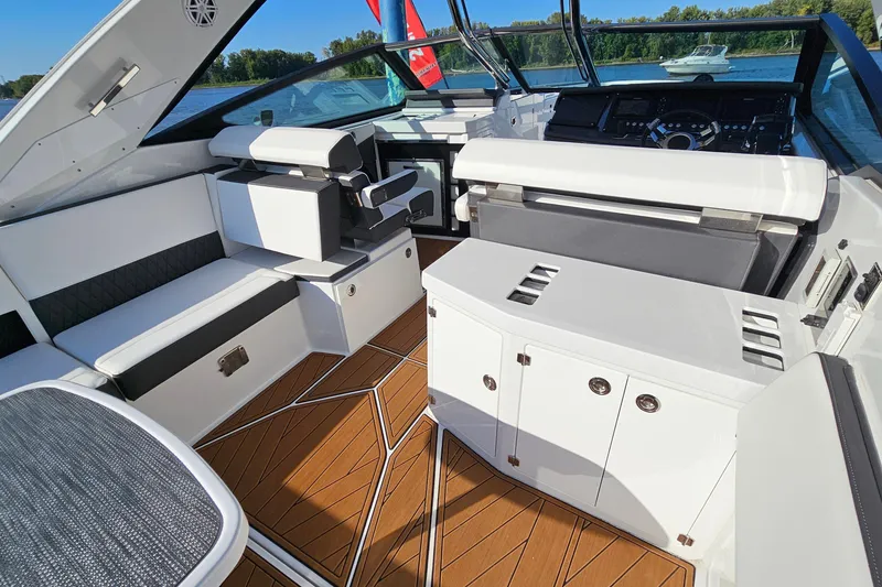 Slide: The Image of 2022 Monterey 378SS Super Sport boat interior with sleek seating and modern dashboard. - 11