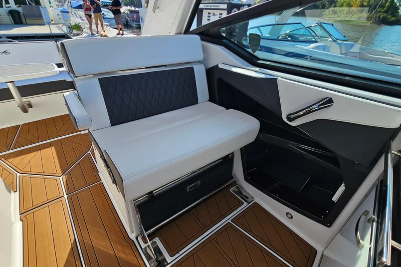 Slide: The Image of 2022 Monterey 378SS Super Sport interior with sleek seating and wood-patterned flooring. - 13
