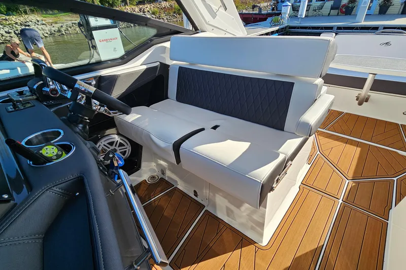 Slide: The Image of 2022 Monterey 378SS Super Sport boat interior with luxurious seating and modern dashboard. - 14