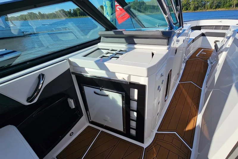 Slide: The Image of 2022 Monterey 378SS Super Sport boat interior with sleek design and wooden flooring. - 17
