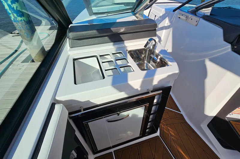 Slide: The Image of 2022 Monterey 378SS Super Sport boat interior with sink and storage area. - 18