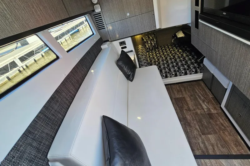 Slide: The Image of Luxurious interior of 2022 Monterey 378SS Super Sport boat with modern seating and stylish decor. - 23