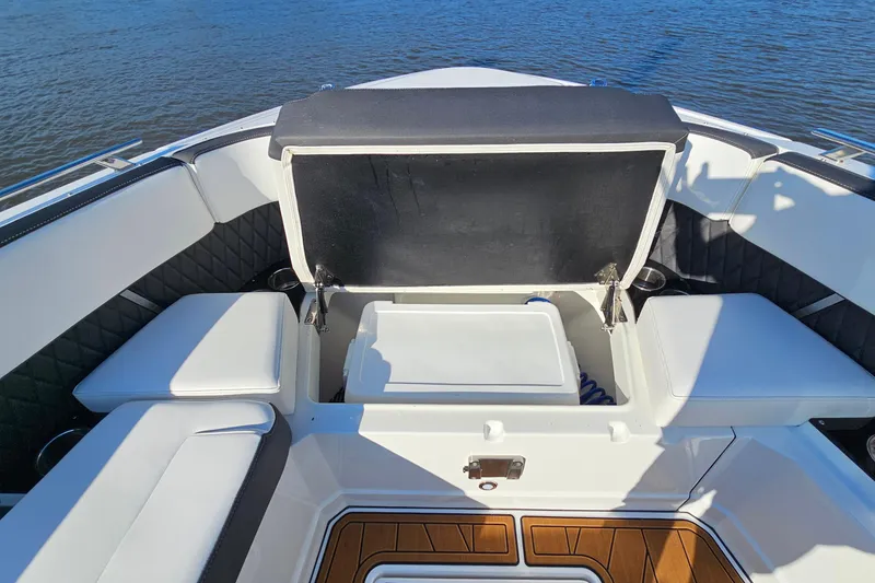 Slide: The Image of 2022 Monterey 378SS Super Sport boat interior with open storage compartment. - 30