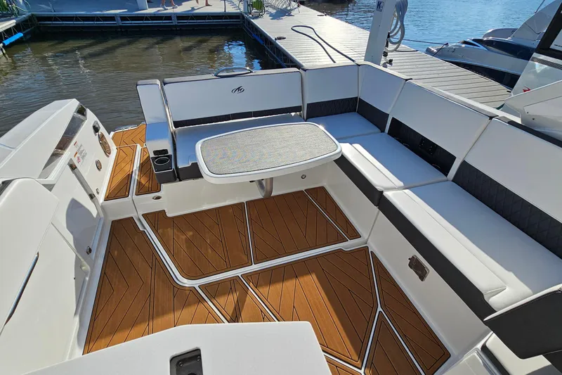 Slide: The Image of 2022 Monterey 378SS Super Sport boat interior with elegant seating and wooden flooring. - 8