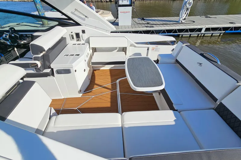 Slide: The Image of Luxurious interior of 2022 Monterey 378SS Super Sport boat with sleek seating and table. - 9