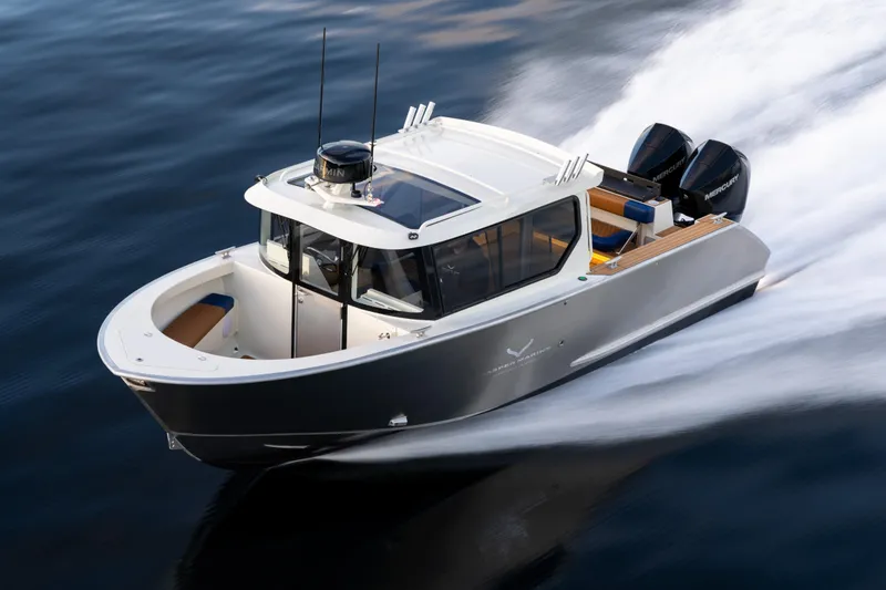 Slide: The Image of 2026 Jasper Marine Defender 22 boat speeding on water with dual engines. - 8
