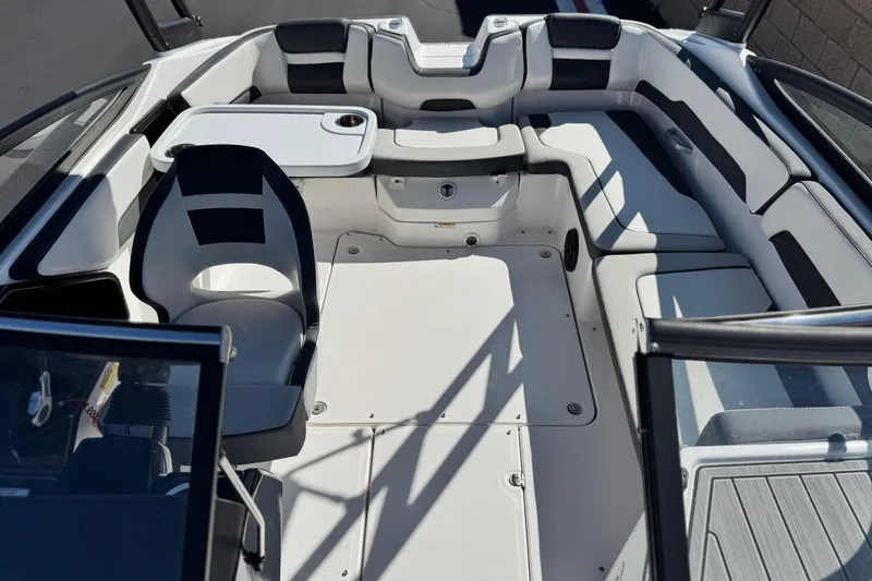 Slide: The Image of 2023 Yamaha Boats AR195 interior with seating and table, showcasing modern design and comfort. - 15