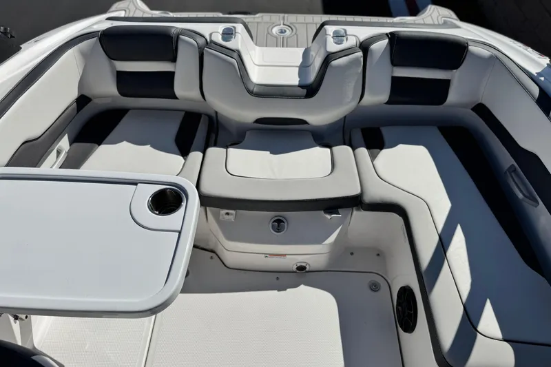 Slide: The Image of 2023 Yamaha Boats AR195 interior with seating and table, featuring modern design and comfort. - 16