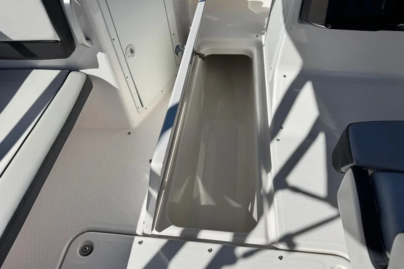 Slide: The Image of 2023 Yamaha AR195 boat interior storage compartment with open hatch. - 21