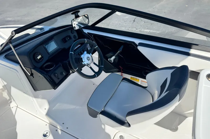 Slide: The Image of 2023 Yamaha Boats AR195 cockpit with steering wheel and dashboard controls. - 23