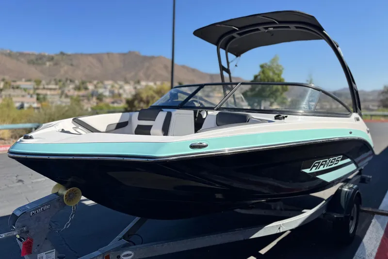 Slide: The Image of 2023 Yamaha AR195 boat on trailer, scenic mountain backdrop. - 3