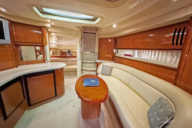 Slide: The Image of Luxurious interior of a 2003 Sea Ray 420 Sundancer yacht with elegant seating and wood finishes. - 20